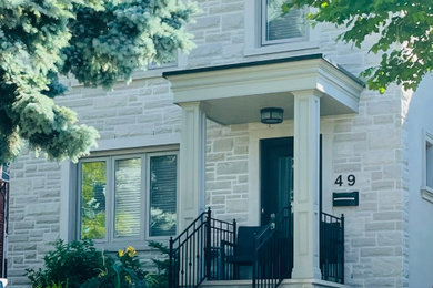 Elegant stone exterior home photo in Toronto