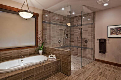 Inspiration for a mid-sized transitional master bathroom in Other with a drop-in tub, an alcove shower, beige tile, brown tile, ceramic tile, beige walls, ceramic floors, beige floor and an open shower.
