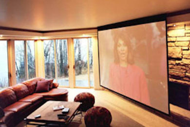 Home theater - large carpeted home theater idea in Minneapolis with a projector screen