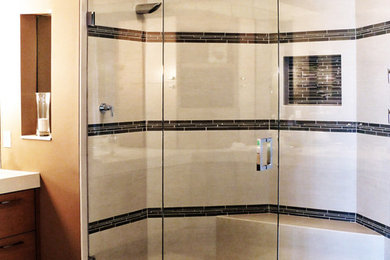 This is an example of a mid-sized traditional bathroom in Miami with flat-panel cabinets, medium wood cabinets, an alcove shower, black tile, porcelain tile, brown walls, bamboo floors and engineered quartz benchtops.