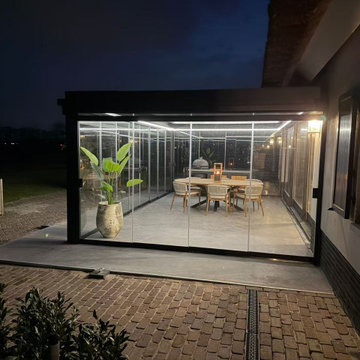 Louvered Motorized Pergola With Sliding Glass Door
