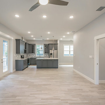 The Sea Breeze | Great Room, Kitchen and Hallway | New Home Builders in Tampa F
