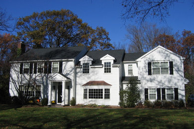 Inspiration for a mid-sized timeless white two-story wood exterior home remodel in New York