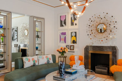 Inspiration for an expansive contemporary formal enclosed living room feature wall in London with white walls, light hardwood flooring, a wood burning stove, a stone fireplace surround, no tv and beige floors.