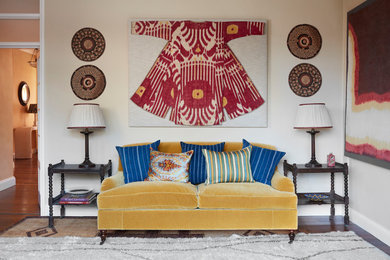 Eclectic enclosed carpeted and coffered ceiling living room photo with beige walls