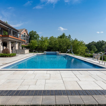 Burr Ridge Lap Pool with Raised Hot Tub and Waterfall