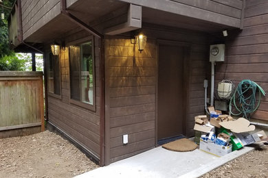 Inspiration for a mid-sized brown two-story wood house exterior remodel in Seattle