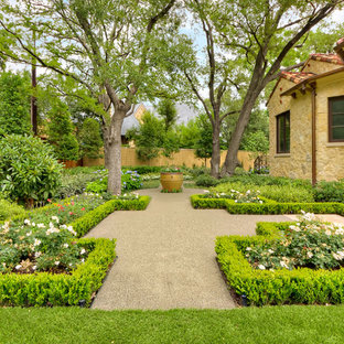 Small mediterranean courtyard formal garden in Dallas with with privacy feature.