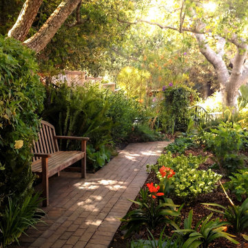 Brick garden path and seating area in Pebble Beach landscape