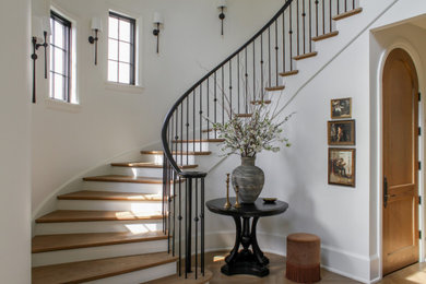 Inspiration for a mid-sized transitional wooden curved staircase remodel in Chicago with wooden risers