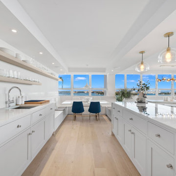 Large Beach House Kitchen With White Cabinets