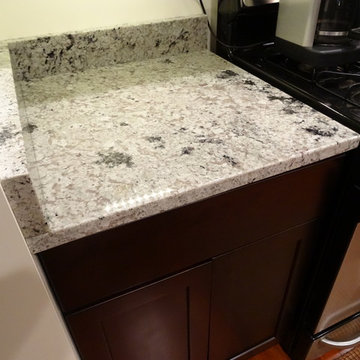 Espresso Cabinets with Romano Dream Granite Countertops