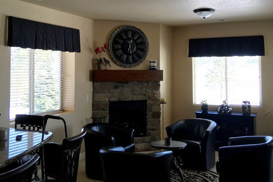 Mid-sized elegant open concept carpeted family room photo in Denver with a bar, yellow walls, a standard fireplace, a stone fireplace and no tv