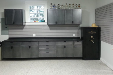 Inspiration for a mid-sized contemporary attached one-car garage workshop remodel in Other