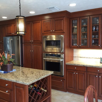 Two Tall Pantries Flank the Refrigerator, Glass Doors Display Glassware