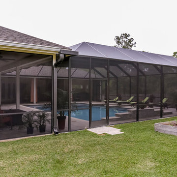 Patio with Fireplace with Screened Pool Enclosure