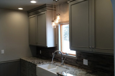 Small country galley porcelain tile kitchen photo in Other with a farmhouse sink, gray cabinets, granite countertops, brown backsplash, porcelain backsplash and white appliances