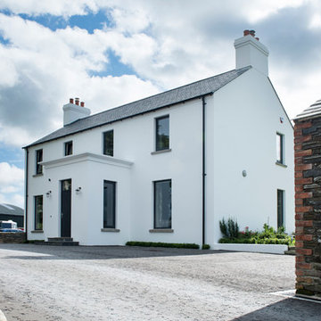 New build contemporary farmstead with curved metal roof
