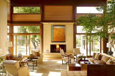 Example of a huge trendy open concept carpeted and beige floor living room design in San Francisco with beige walls, a standard fireplace, a tile fireplace and no tv