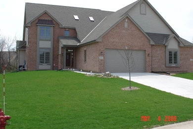 Example of a large trendy home design design in Milwaukee