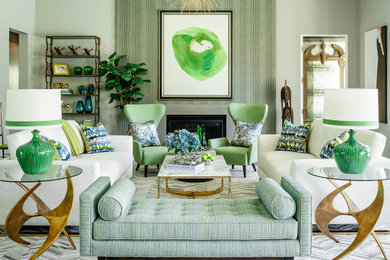 Transitional formal and enclosed medium tone wood floor and brown floor living room photo in Los Angeles with green walls, a standard fireplace and no tv
