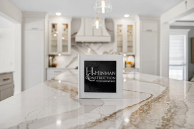 Example of a huge transitional light wood floor eat-in kitchen design in Other with an undermount sink, recessed-panel cabinets, green cabinets, quartz countertops, multicolored backsplash, quartz backsplash, white appliances, an island and multicolored countertops