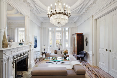 Inspiration for a victorian formal and enclosed medium tone wood floor living room remodel in New York with white walls and no tv