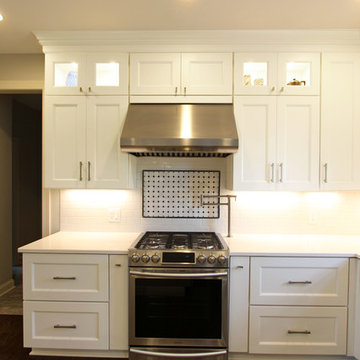 White Kitchen with Gray and Black Quartz Countertop and Bar Area ~ Streetsboro