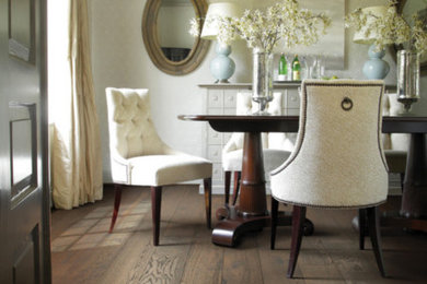 Example of a mid-sized trendy dark wood floor enclosed dining room design in Minneapolis with beige walls and no fireplace