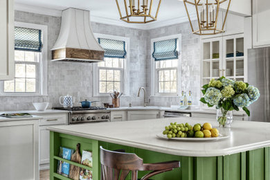 Large transitional l-shaped medium tone wood floor and brown floor eat-in kitchen photo in St Louis with an undermount sink, shaker cabinets, green cabinets, quartz countertops, white backsplash, terra-cotta backsplash, stainless steel appliances, an island and white countertops