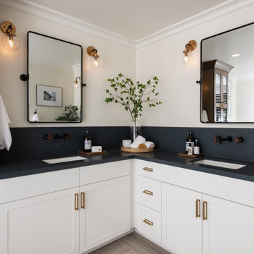 Double Sink Vanity with Brass Fixtures and Pulls in Remodel