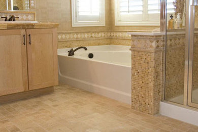 Inspiration for a large master beige tile and ceramic tile ceramic tile bathroom remodel in Other with an undermount sink, shaker cabinets, light wood cabinets and beige walls