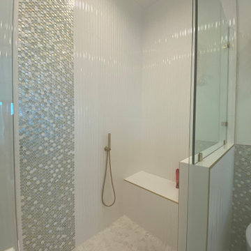 Stunning Bathroom with wavy tiles and penny round mosaic