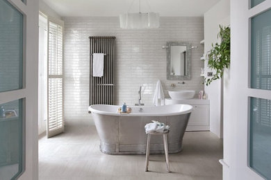 Inspiration for a small transitional white tile and ceramic tile porcelain tile freestanding bathtub remodel in New York