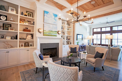 Example of a large transitional formal and open concept medium tone wood floor living room design in Atlanta with white walls, a standard fireplace, a concrete fireplace and no tv