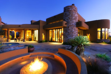 Southwest patio photo in Phoenix with a fire pit