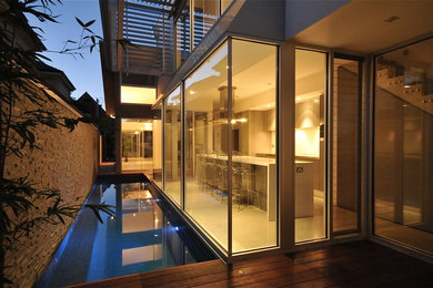 This is an example of a small contemporary courtyard rectangular lap pool in Adelaide with decking.
