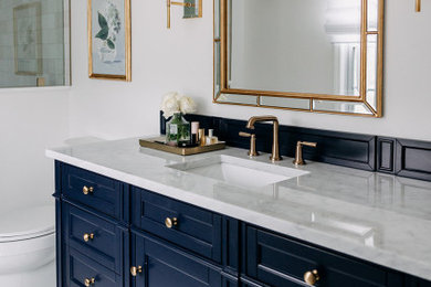 Inspiration for a mid-sized timeless master white tile and ceramic tile single-sink bathroom remodel in Detroit with blue cabinets, a hinged shower door and a freestanding vanity