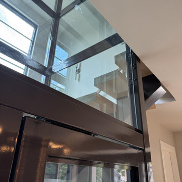 Project #136 | Modern Floating Staircase Encircling Glass Elevator