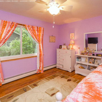 New Sliding Window in Colorful Bedroom - Renewal by Andersen Long Island