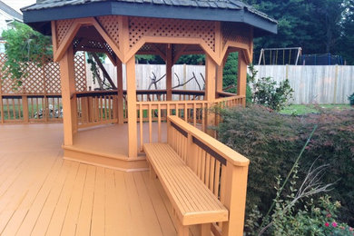Mid-sized arts and crafts backyard deck photo in DC Metro with no cover