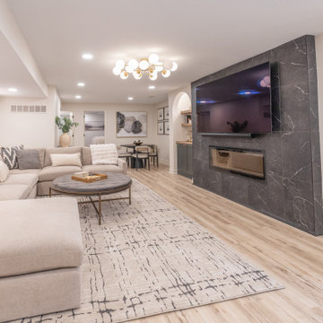 Warm & Inviting Basement Retreat with Custom Bar + Entertainment Center