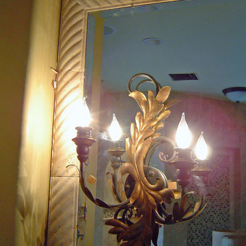 Mirror with Stone Frame and Ornate Light Sconce