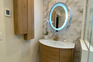 Small minimalist master white tile and porcelain tile porcelain tile, beige floor and single-sink bathroom photo in New York with furniture-like cabinets, light wood cabinets, a two-piece toilet, white walls, an undermount sink, glass countertops, a hinged shower door, white countertops and a floating vanity