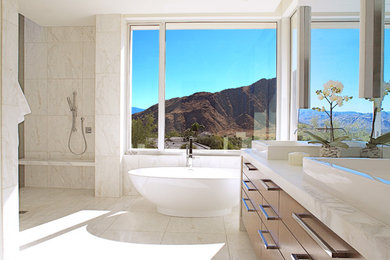 Bathroom - huge contemporary master white tile and stone tile marble floor and beige floor bathroom idea in Los Angeles with flat-panel cabinets, dark wood cabinets, a one-piece toilet, white walls, a vessel sink and marble countertops