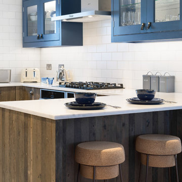 Industrial Rustic kitchen with doors made from 100 year old Reclaimed wood.
