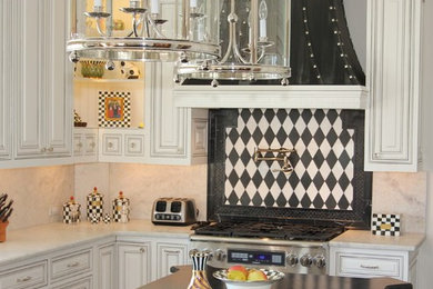 Example of a mid-sized classic u-shaped black floor and slate floor eat-in kitchen design in Other with a double-bowl sink, recessed-panel cabinets, white cabinets, granite countertops, white backsplash, stone slab backsplash, stainless steel appliances and an island