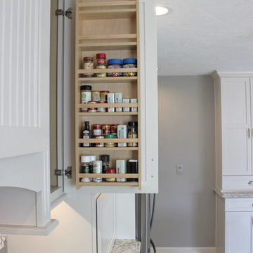 Alpha, IL White and Gray Kitchen with Hidden Laundry and Raised Dishwasher