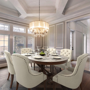 Inspiration for a timeless medium tone wood floor and brown floor enclosed dining room remodel in Jacksonville with gray walls