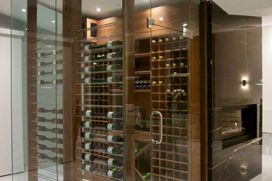 Wine cellar - small contemporary wine cellar idea in Vancouver